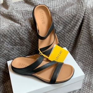 Strive black leather slides